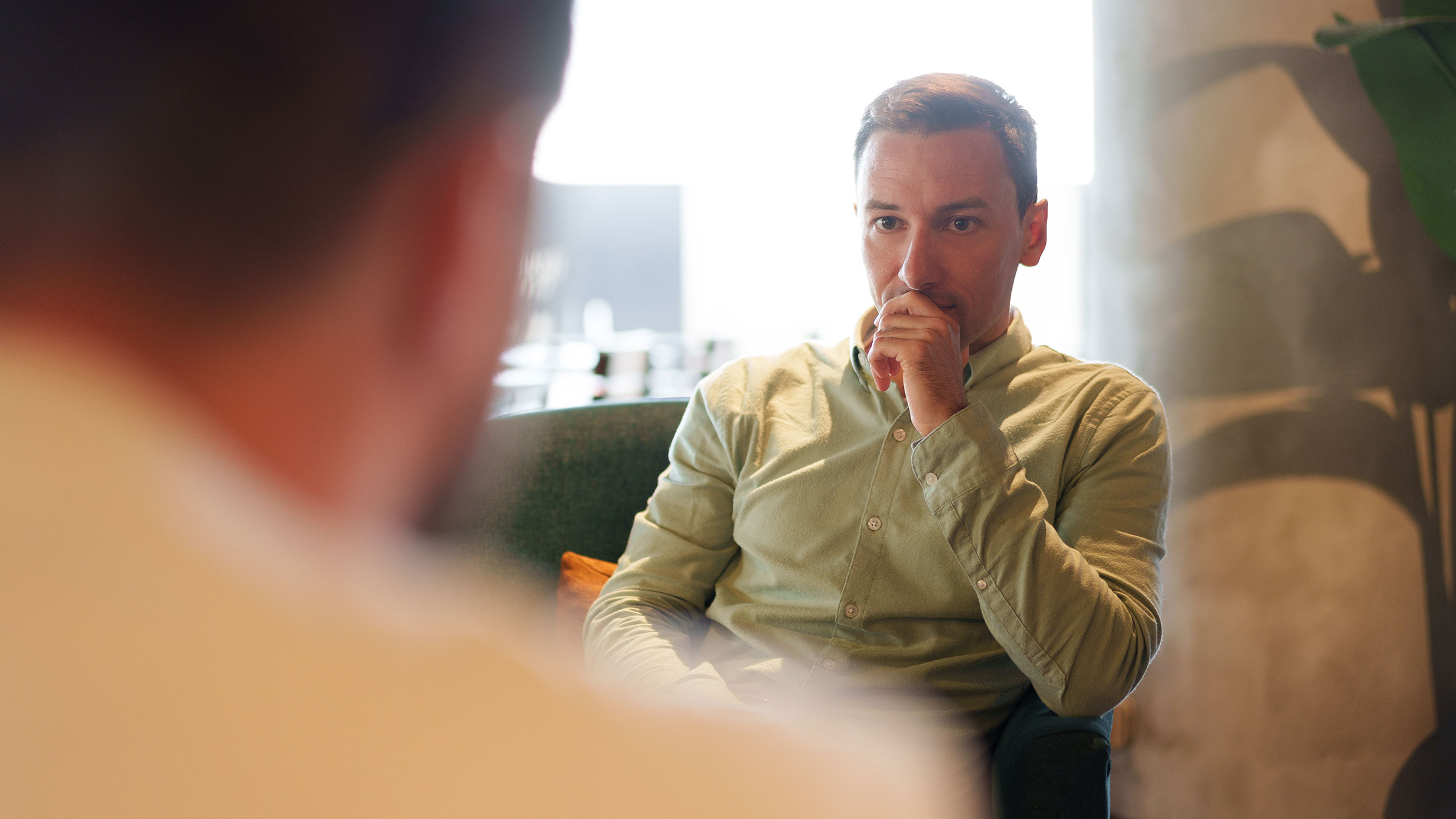 Manager listening to employee in casual environment