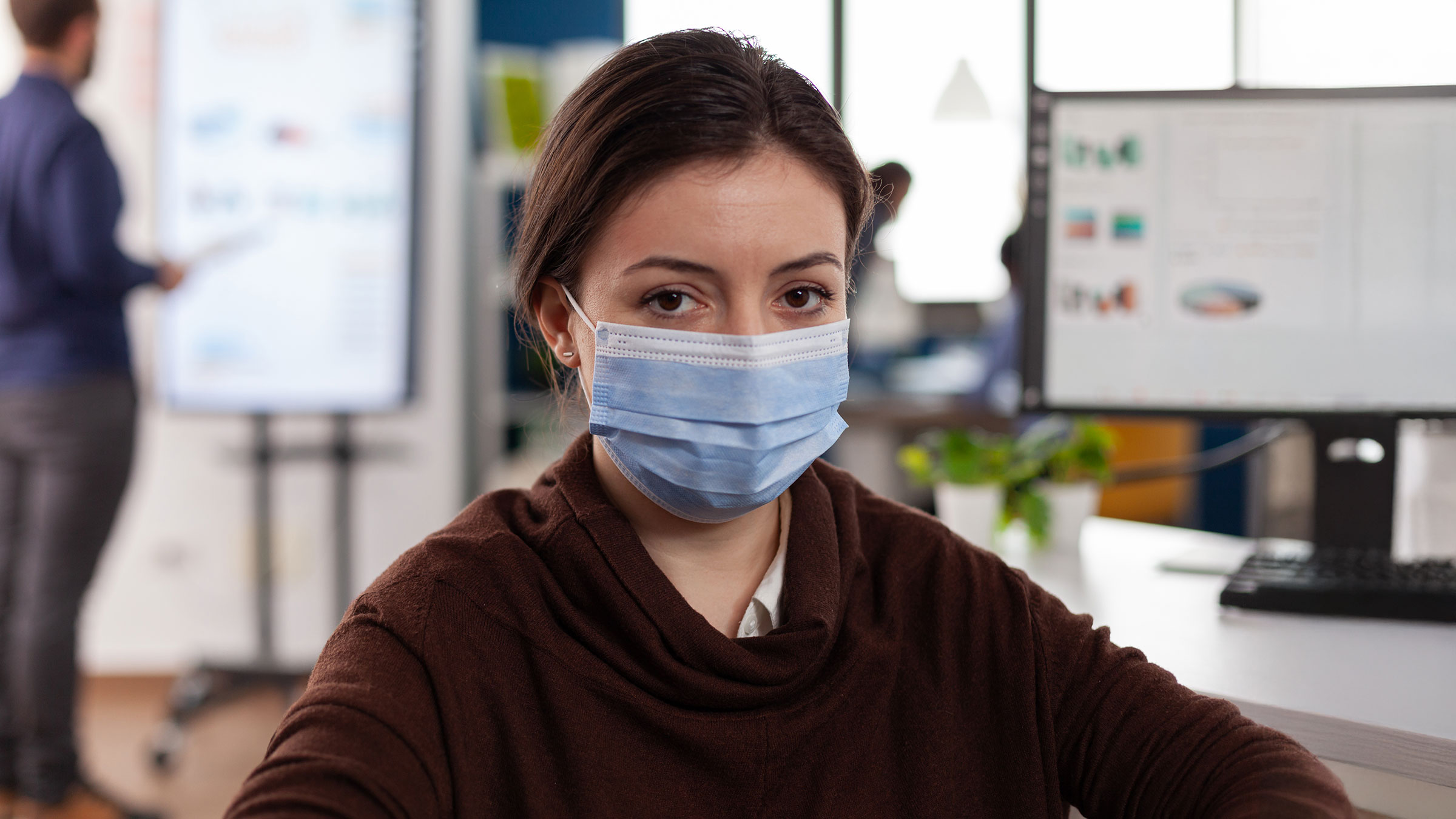 Businesswoman wearing protective face mask