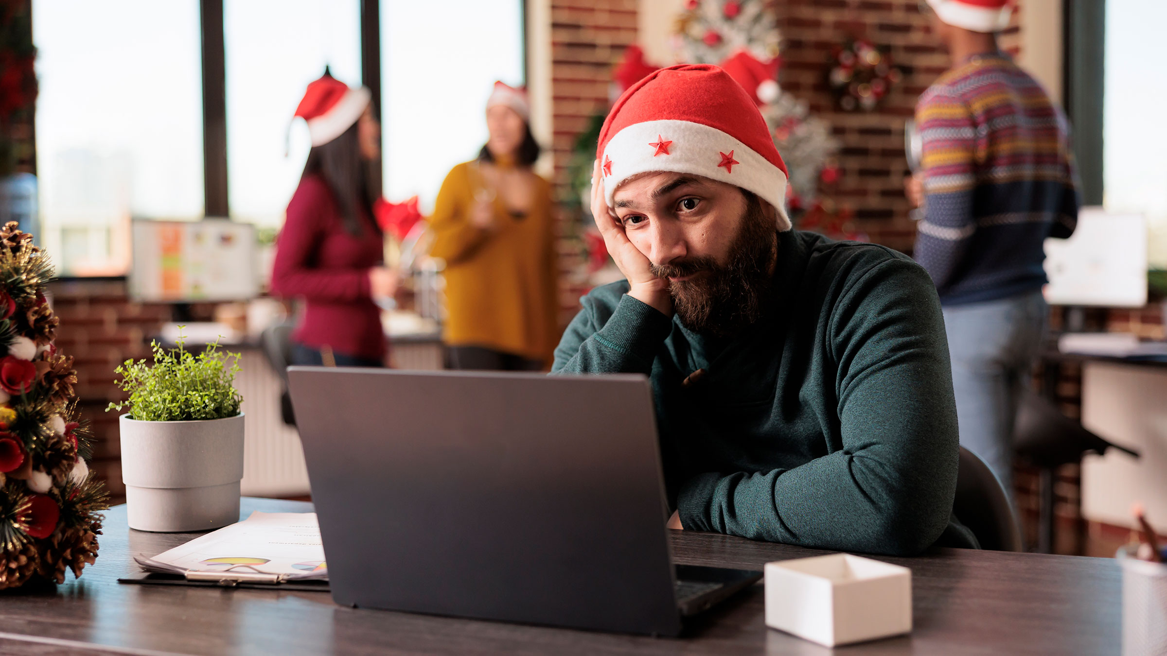 Sad man left out of office holiday celebration