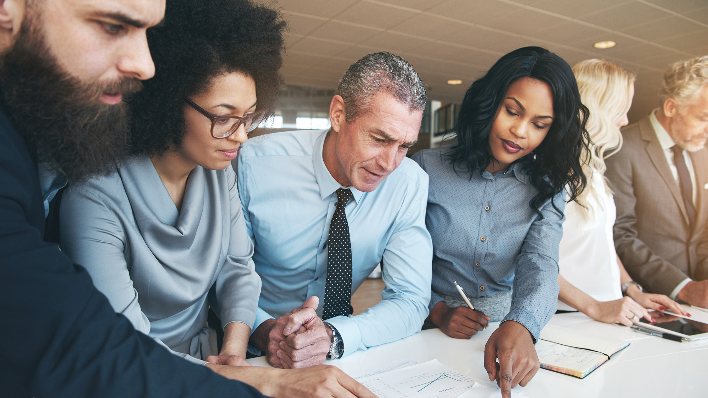 Diverse group of people working together on a project
