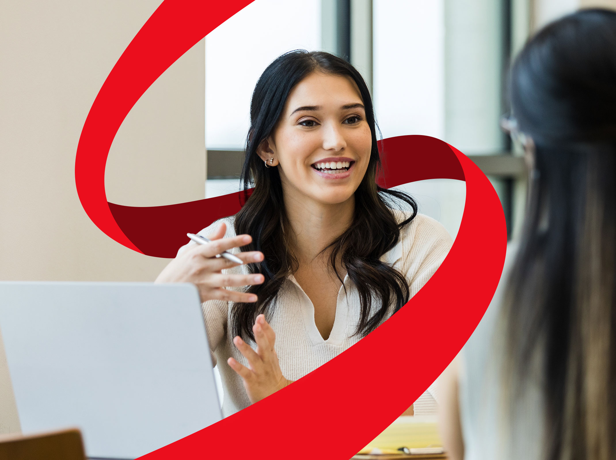 Confident woman speaking to a coworker
