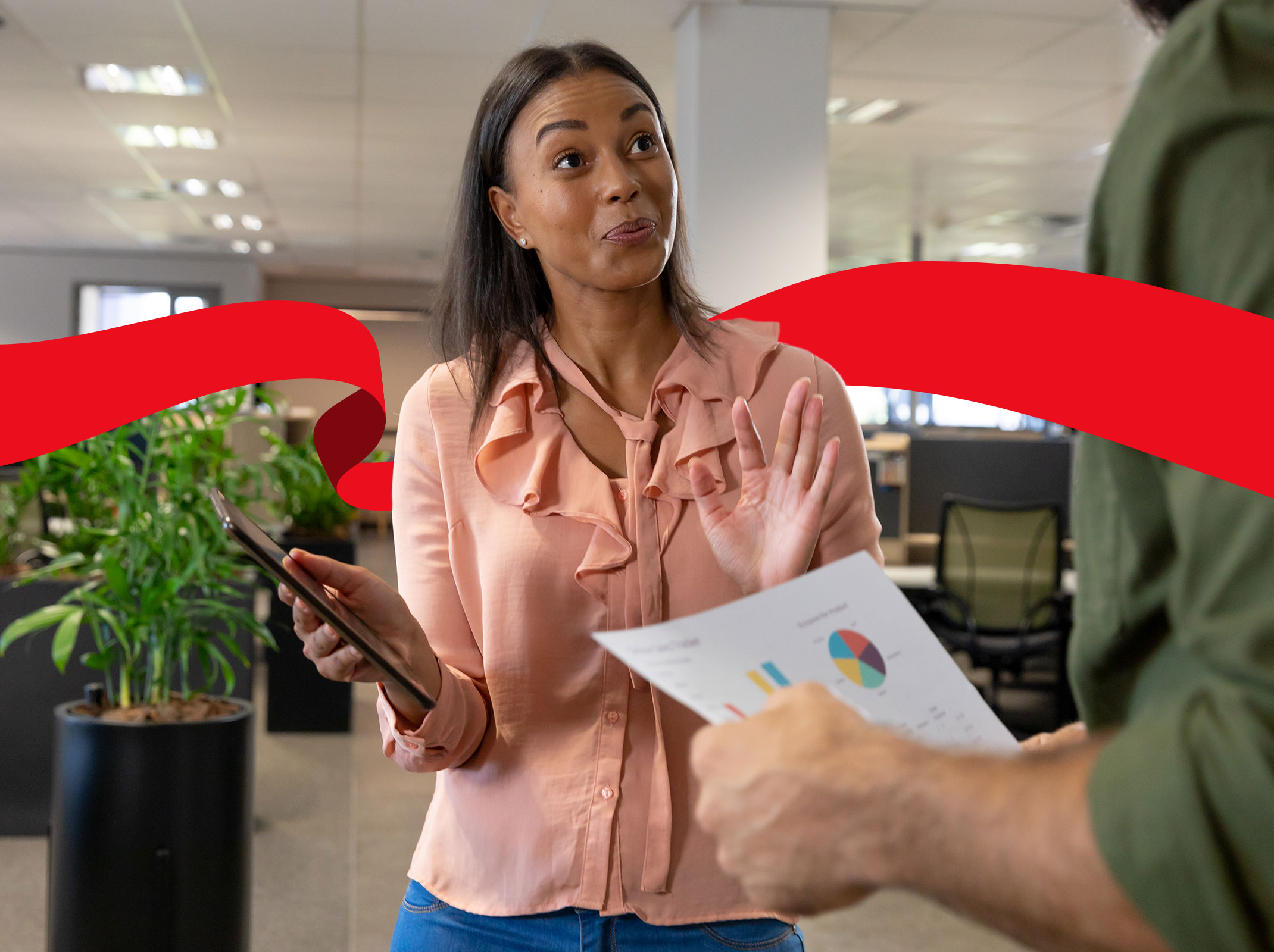 Co-workers engaged in distracting conversation at the office