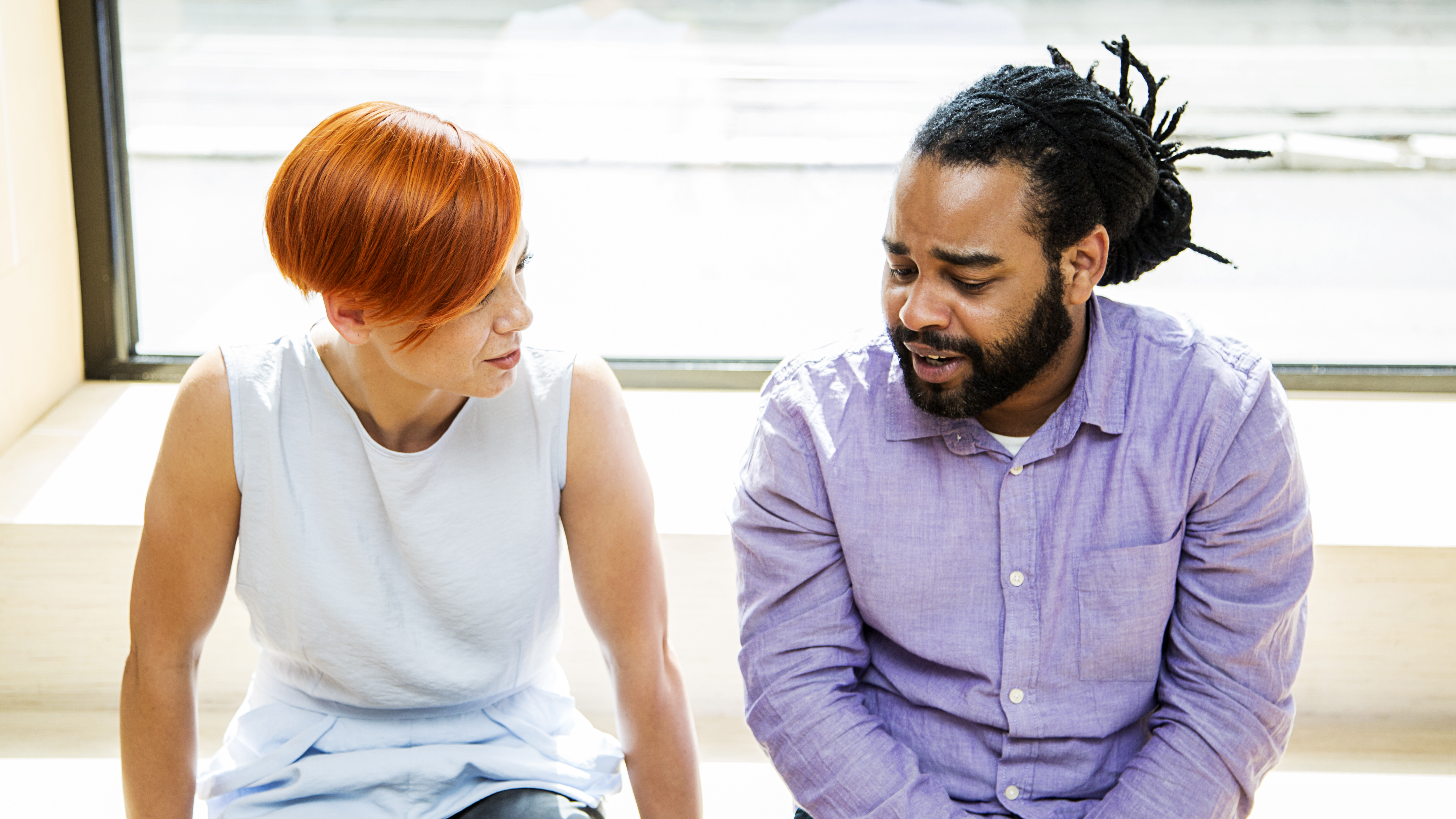 A man and a woman having a serious conversation