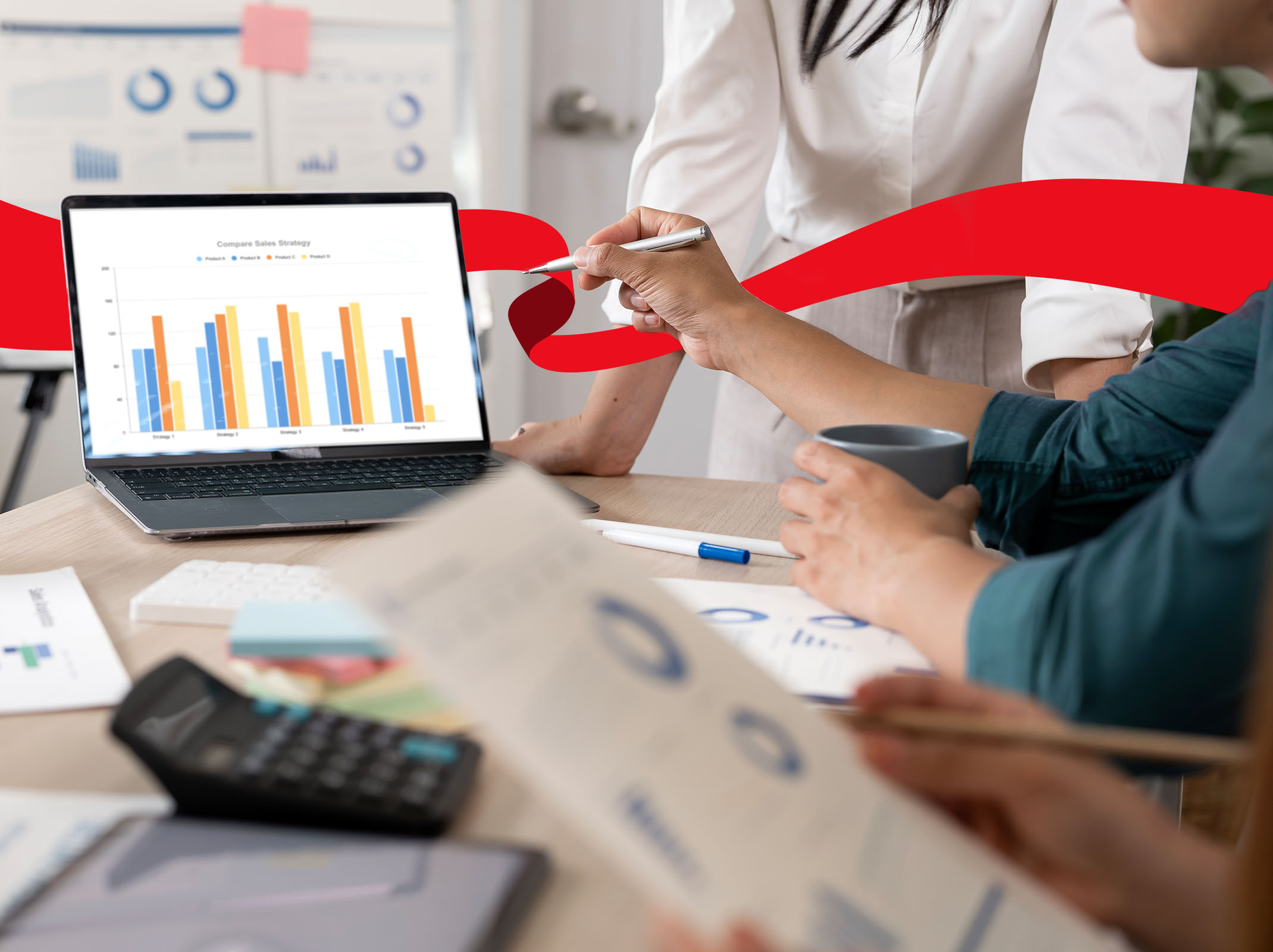Team members review charts and data reports during a collaborative data analysis meeting.