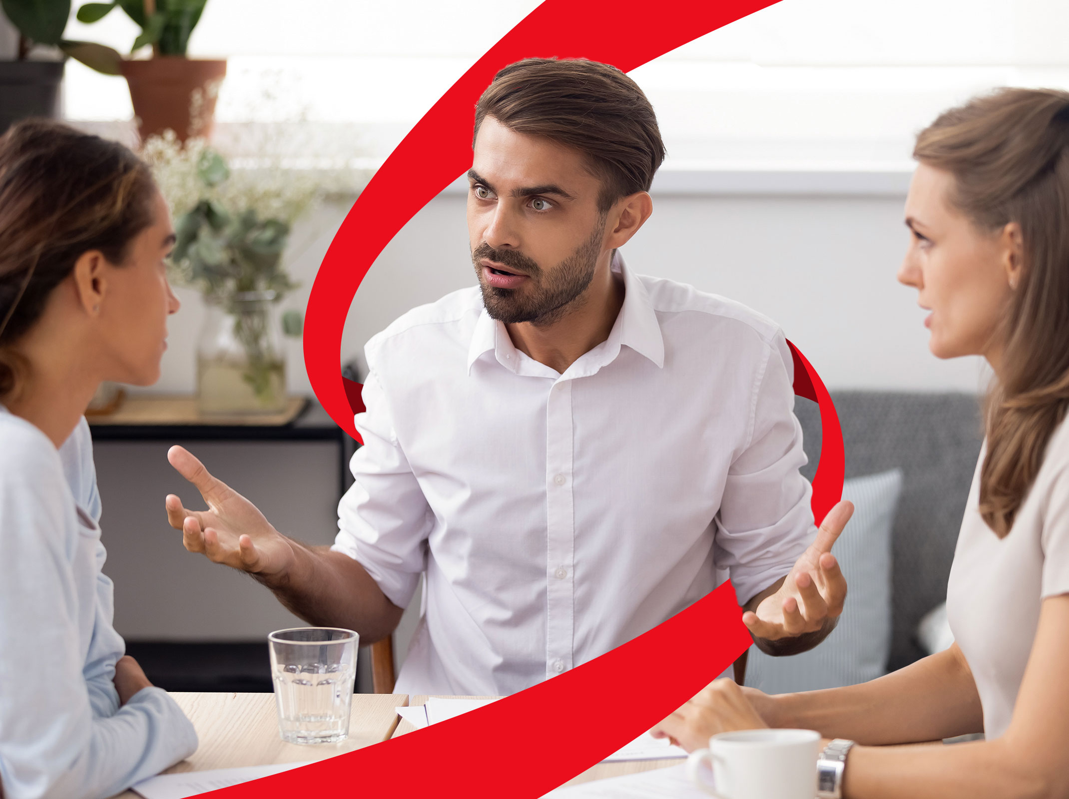 Business professionals conversation at table that appears to have conflict