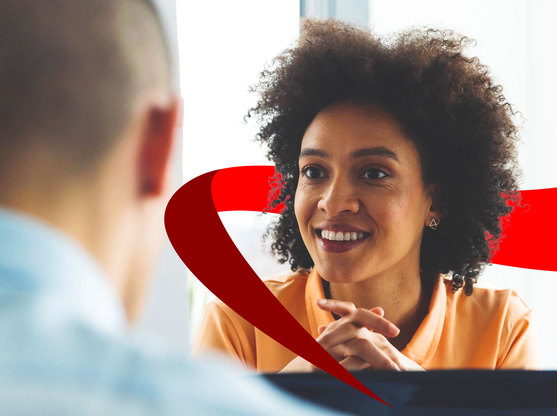 Employee and manager engaged in a one-on-one workplace discussion