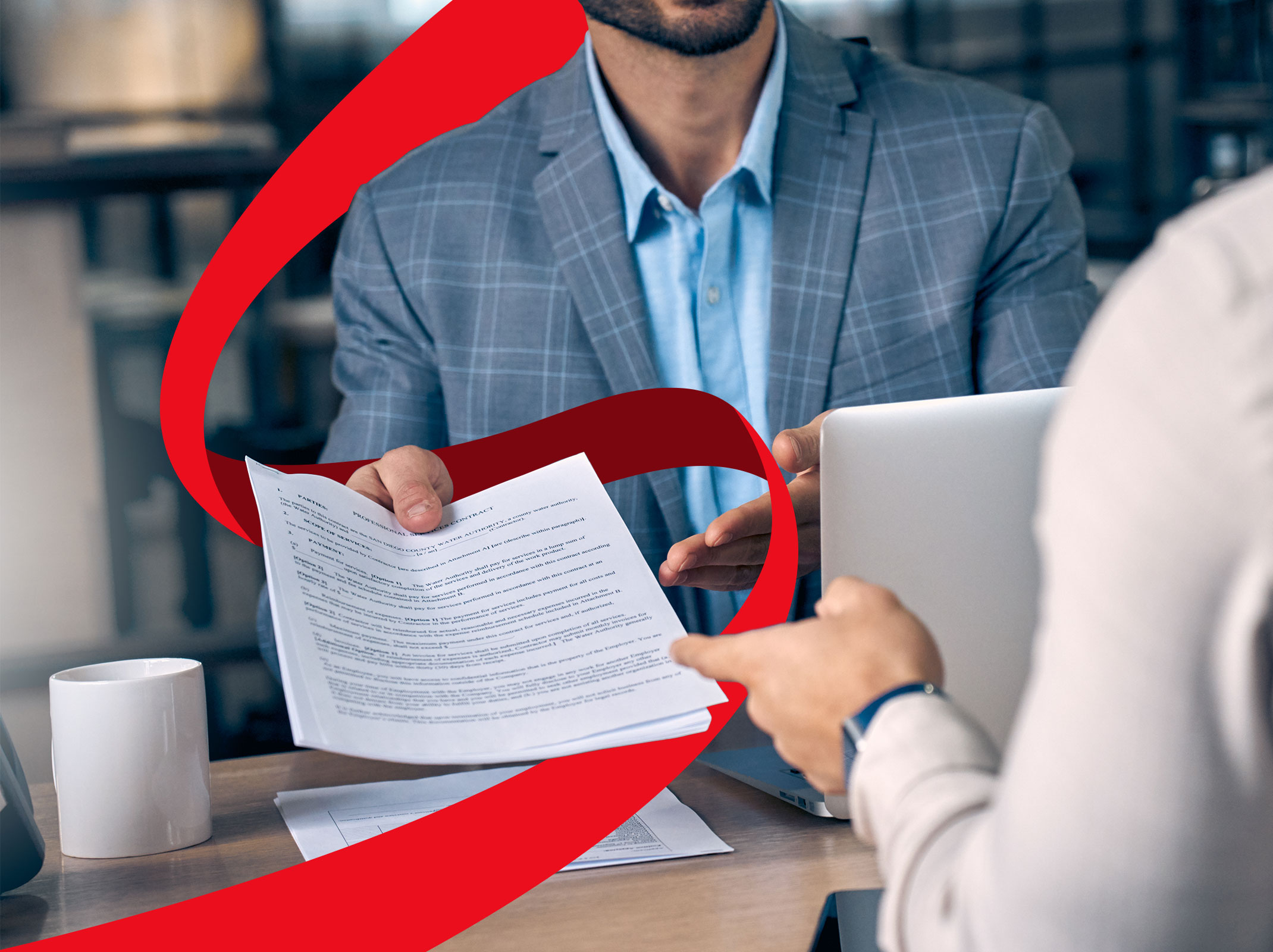 Business professional handing FMLA paperwork to another business professional