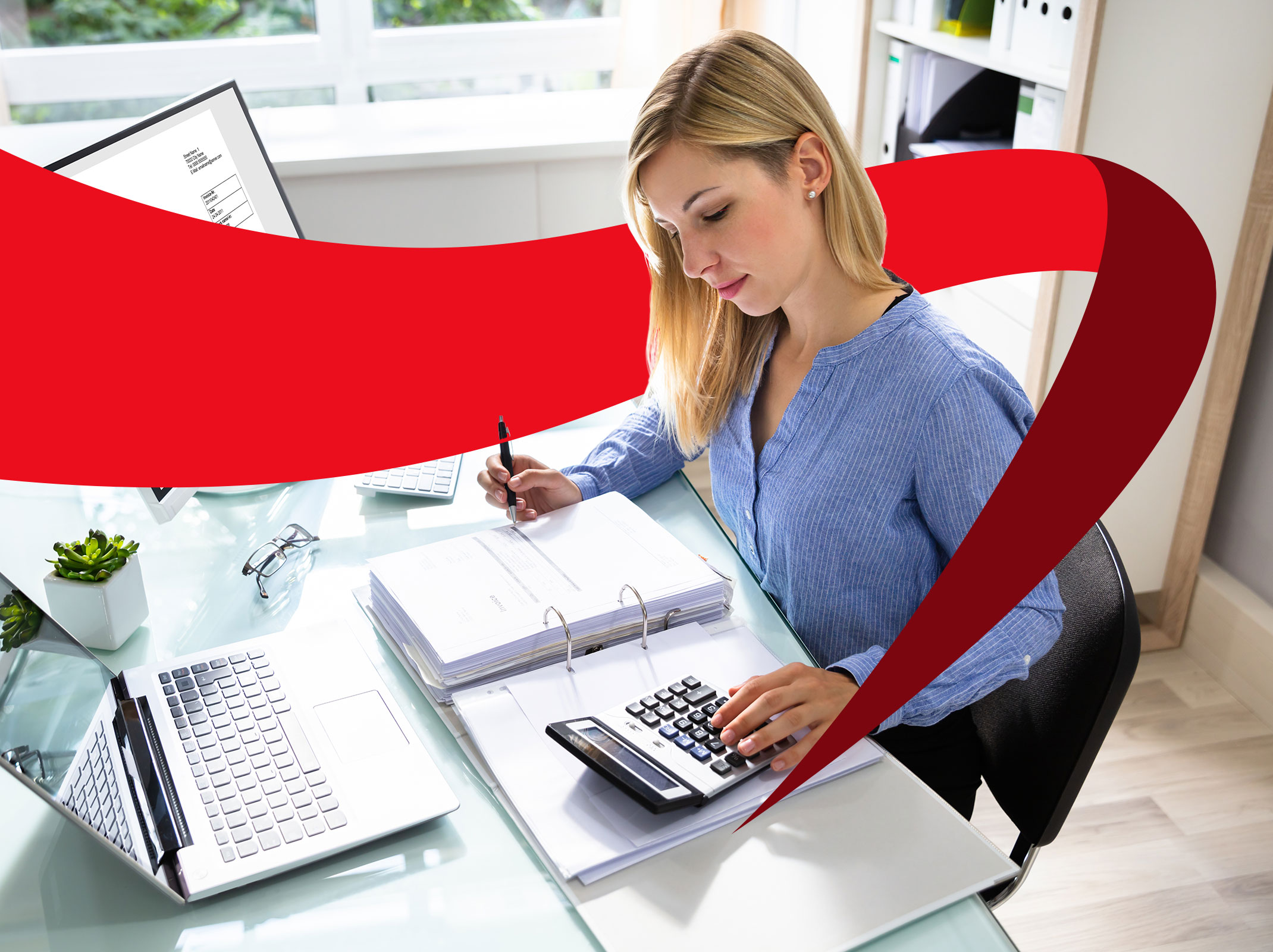 Accounts payable professional working on documents with a computer and calculator