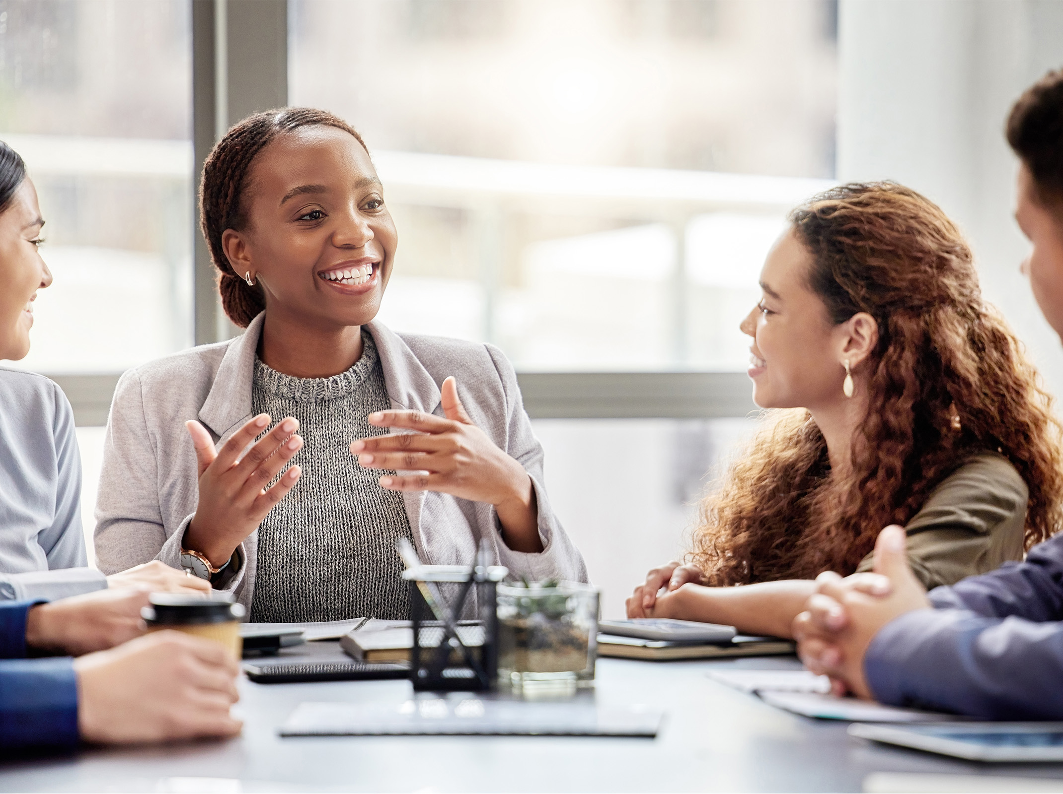 Employees engaged in an open discussion during a team meeting