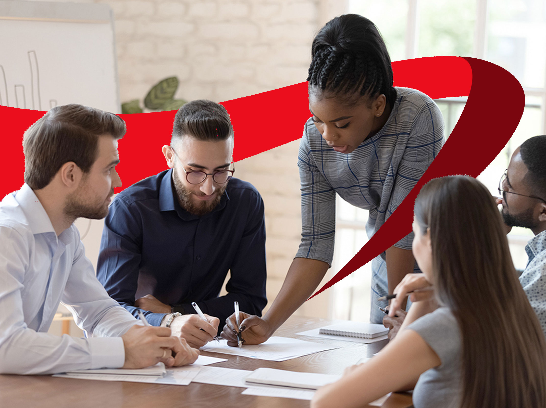 Leader explaining something at a conference table to her team