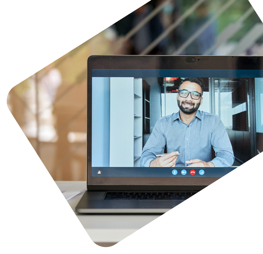 A person teaching a virtual class on an office laptop